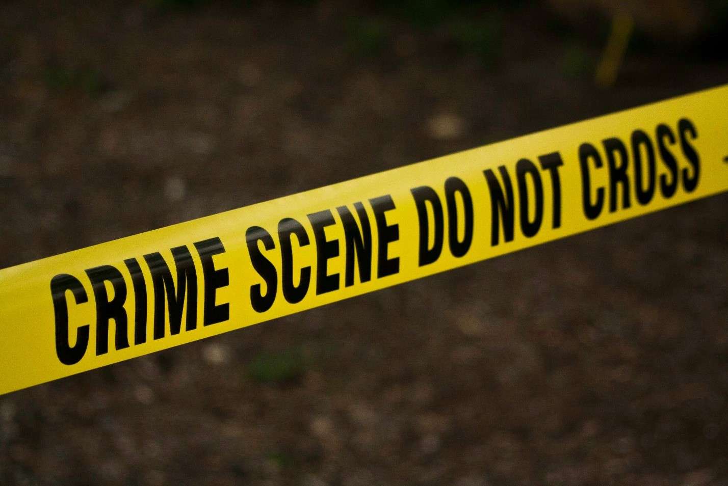 'CRIME SCENE DO NOT CROSS' Indicating an Area of Investigation, Maintaining the Integrity of a Potential Crime Scene