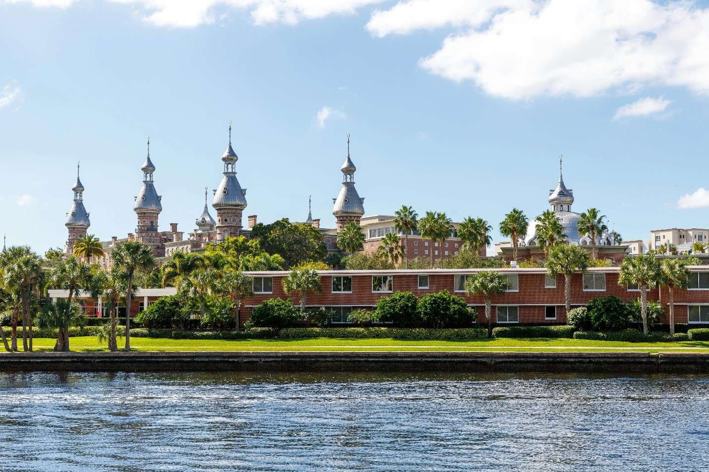 A Scenic View Across River Showcasing the Historic University of Tampa with Its Distinctive Minarets and Victorian Architecture